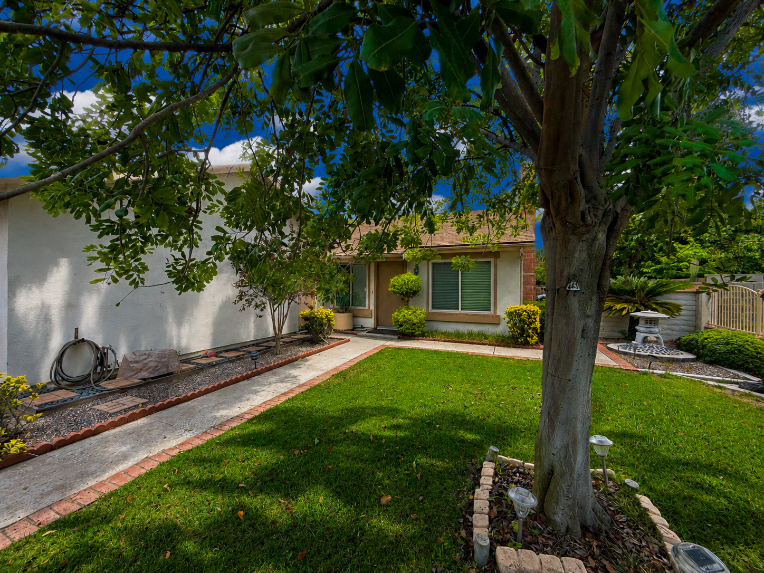 Front walkway and lush yard at 13132 Marshall Ln