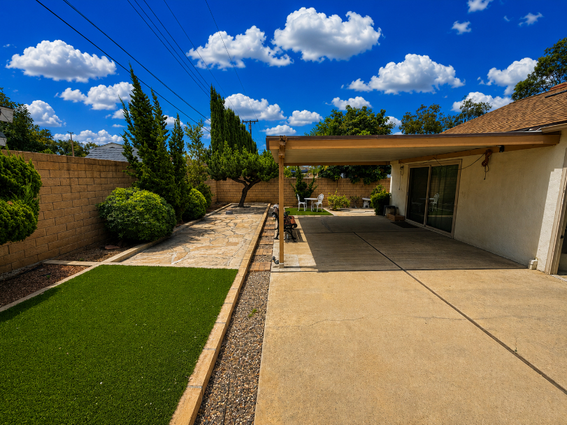 Expansive backyard patio and lawn